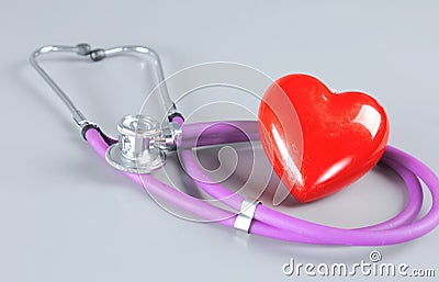 Medical stethoscope and red heart isolated on white Stock Photo