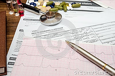 Medical still life with patient health information, cardiogram, pills, stethoscope Stock Photo