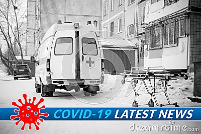 Medical stretcher near to ambulance with open doors on the street with image of coronavirus covid-19 and inscription latest news. Stock Photo