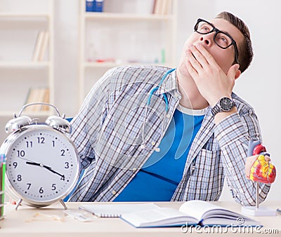 Medical student missing deadlines to complete assignment Stock Photo