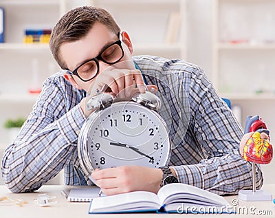 Medical student missing deadlines to complete assignment Stock Photo