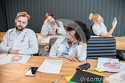 Medical students at the boring lesson Stock Photo