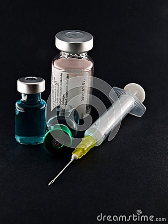 Medical syringe and phials Stock Photo
