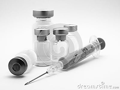 Medical syringe and phials Stock Photo