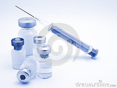 Medical syringe and phials Stock Photo