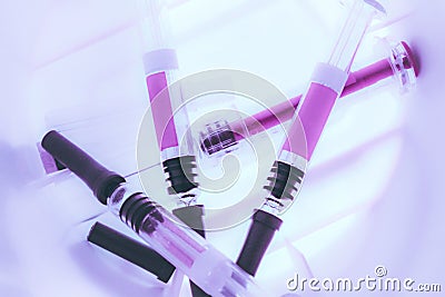 Medical Syringes inside a Sharps Collector Stock Photo