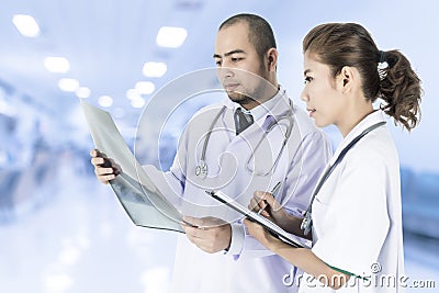 Medical team checking on X-ray results Stock Photo