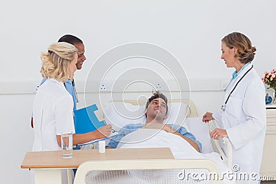 Medical team taking care of a sick patient Stock Photo