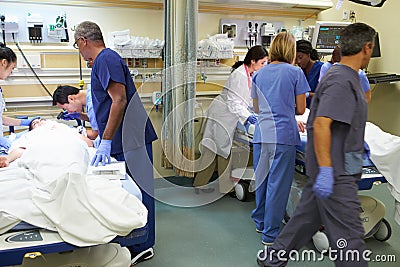 Medical Team Working On Patient In Emergency Room Stock Photo