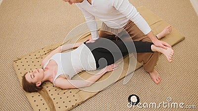 Medical thai massage - caucasian model female - stretch the muscles Stock Photo