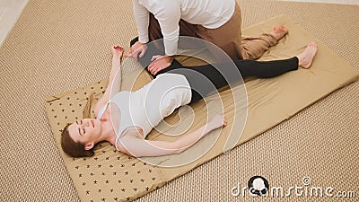 Medical thai massage - caucasian model female - stretch the muscles Stock Photo