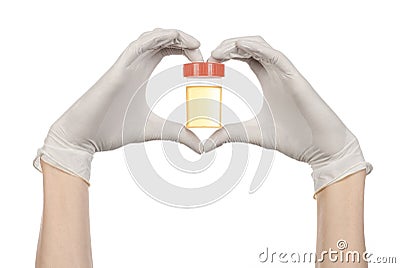 Medical theme: doctor's hand in white gloves holding a transparent container with the analysis of urine on a white background Stock Photo