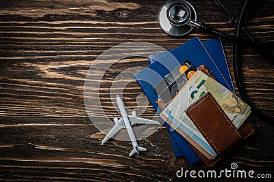 Medical tourism concept - passports, stethoscope, airplane, money Stock Photo