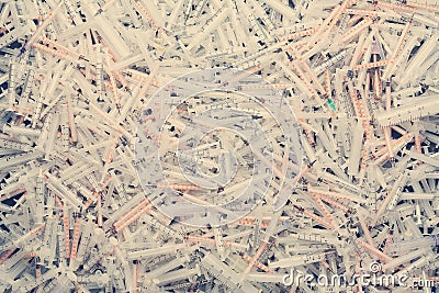 Medical waste. Pile of used syringes, few needles, test tubes. Stock Photo