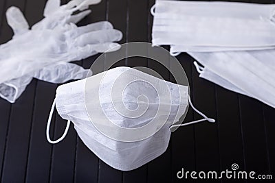 Medical white masks on a black background. Surgical protective mask against viruses and bacteria. The concept of protection Stock Photo