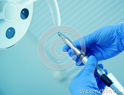 A medical worker connects a disassembled boron machine for dental treatment, preparation for treatment, repair of a medical Stock Photo