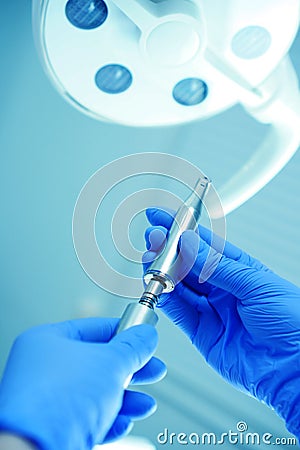 A medical worker connects a disassembled boron machine for dental treatment, preparation for treatment, repair of a medical Stock Photo