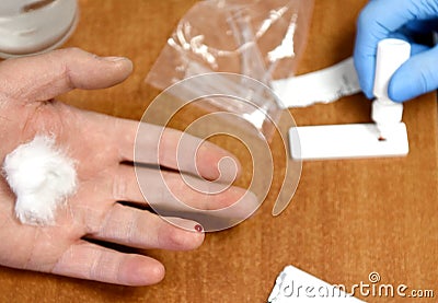 Medical worker makes a rapid test for coronavirus COVID-19. blood test Stock Photo