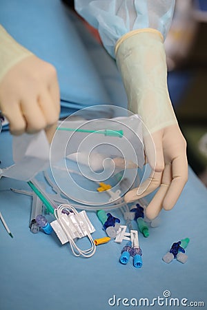 Medical worker opened the pack of catheterization tools during p Stock Photo