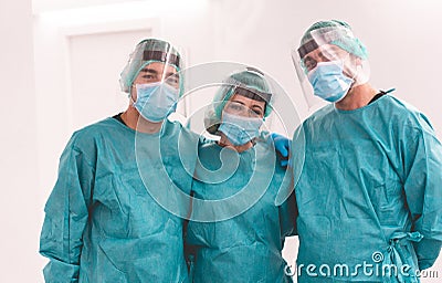 Medical workers inside hospital corridor during coronavirus pandemic outbreak - Doctor and nurse at work on Covid-19 crisis period Stock Photo