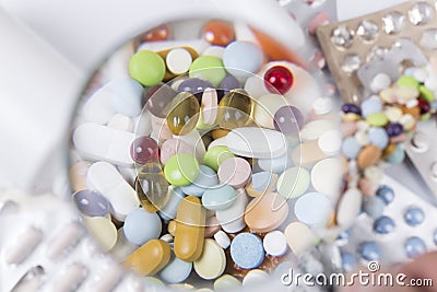 Medicaments under magnifying glass Stock Photo