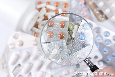 Medicaments under magnifying glass Stock Photo