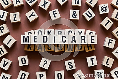 Medicare word concept on cubes Stock Photo