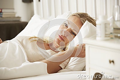 Medication On Bedside Table Of Sleepless Woman Stock Photo