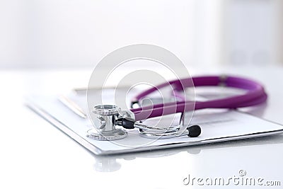 Medication history record form lying on table with stethoscope and silver pen. Medicine or pharmacy concept. Medical Stock Photo