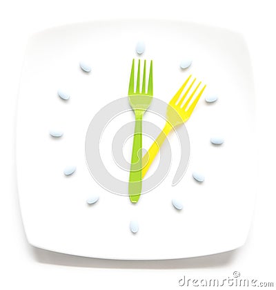Medication and meals Stock Photo