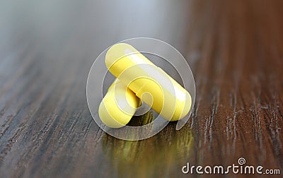 Two yellow pills lie on the table Stock Photo