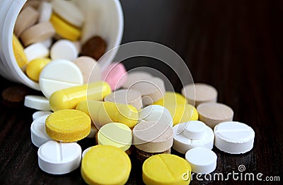 Medication tablets are capsized on the table Stock Photo