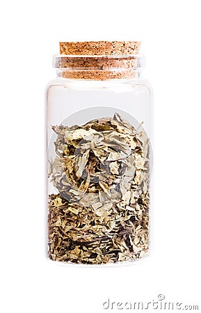 Medicinal herb in a bottle with cork stopper for medical use. Stock Photo