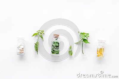 Medicinal herb in bottles on white background top view copyspace Stock Photo