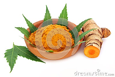 Medicinal turmeric paste with neem leaves Stock Photo
