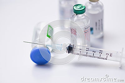 Medicine bottles glass for syringe injection needle on white background - Medication drug bottle equipment medical tool for nurse Stock Photo