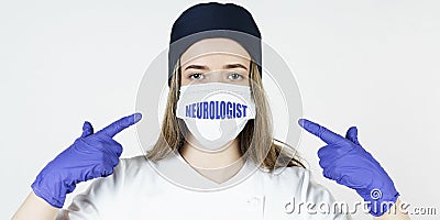 The doctor points his fingers at the mask with the inscription - NEUROLOGIST Stock Photo