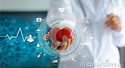 Medicine doctor holding red heart shape and icon medical network Stock Photo