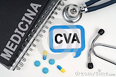 On the table is a stethoscope, a diary and a sign with the inscription - CVA Stock Photo