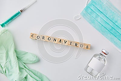 Coronavirus word, mask, gloves, syringe and drug Stock Photo