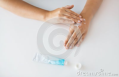 Close up of hands with cream or therapeutic salve Stock Photo