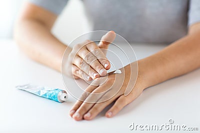 Close up of hands with cream or therapeutic salve Stock Photo