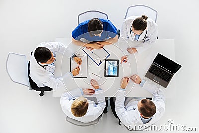 Doctors with spine x-ray on tablet pc computer Stock Photo