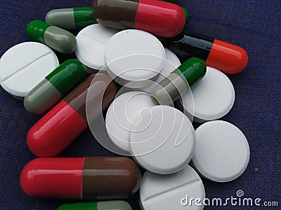 Medicine medical healthcare antibiotics antihistamine pills capsule paracetamol omprezole ocid cure amber colour Stock Photo