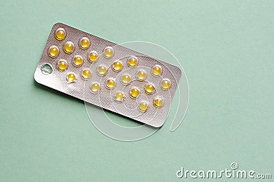 Medicine pills in blister. yellow capsules packed in blisters Stock Photo