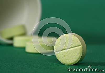 Medicine pills spilling from a bottle Stock Photo