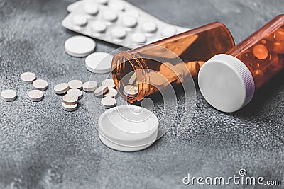 Medicine Pills and tablets with orange pill bottles for healthcare. medical help Stock Photo