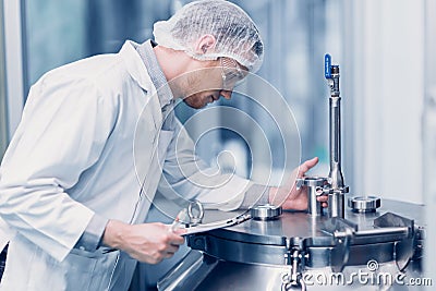 Medicine science factory staff worker products sterilize process in autoclave tank in lab Stock Photo