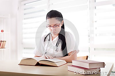 Medicine student learning in the office Stock Photo