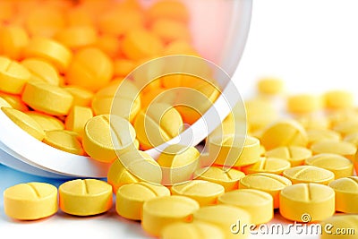 Medicine tablets (or pills) spilling out from the bottle Stock Photo